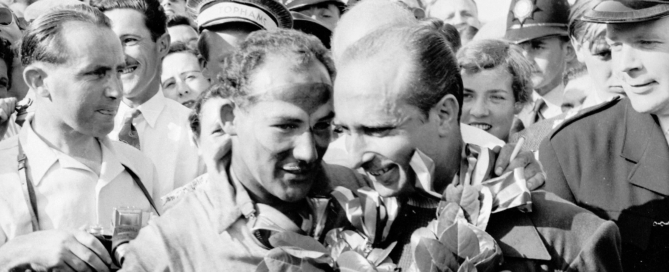 1955 British Grand Prix winner Stirling Moss and runner-up Juan Manuel Fangio on the winners’ podium.