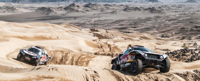 The Mini teammates headed to the finish line in formation on 2021 Dakar Stage 12