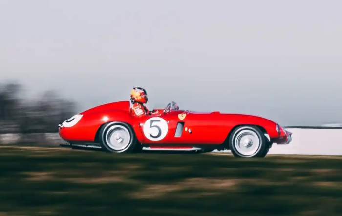 Carlos Sainz in classic Ferrari racecar