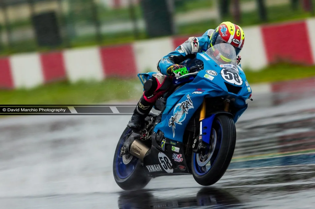 Wet Wheelie - I always admire the skill and outright speed at which the motorcycles race, but to see how agressive they ride their machines while the surface was wet was truly a spectable to capture, and the fact that the rider is ever so slighlty lifting the front wheel makes one appreciate the level of skill involved in pushing their machines to the limits.