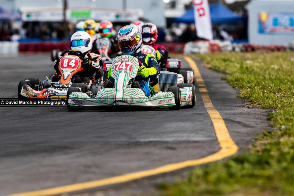 Kart train - this is a very special photo, looking deeper than just the racers, the beautiful low angle, the bokeh from the narrow depth of field placing emphasis on the first kart, yet leaving enough visible to appreciate all around it. 