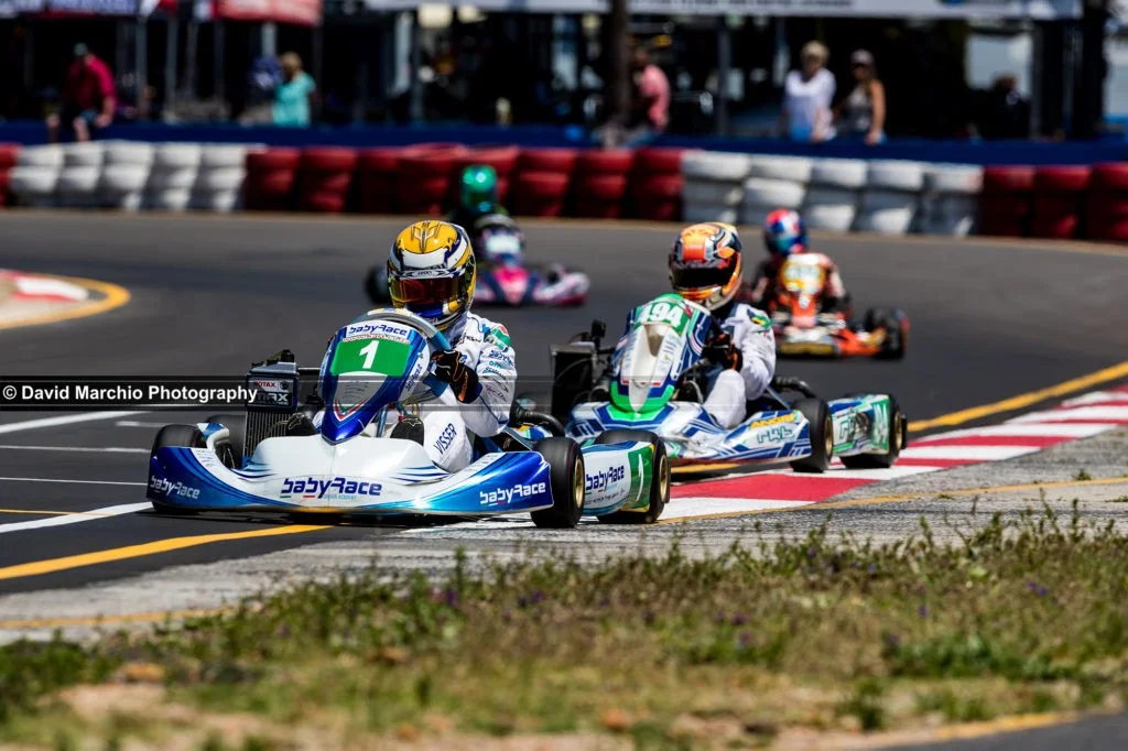Towards the finish line - there is a fine balance between freezing motion and portraying it, golden rule (especially open wheel cars shot head on/at a slight angle), there must be some motion in the wheels. To balance the shutter speed and get the narrow depth of field make this another very special image.