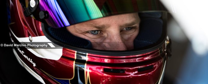 Concentration - capturing the moment of intense focus on a drivers face is tremendous, and having the narrow depth of field, leading ones eye to the focus and clarity of his eye makes this a beautiful image for me.
