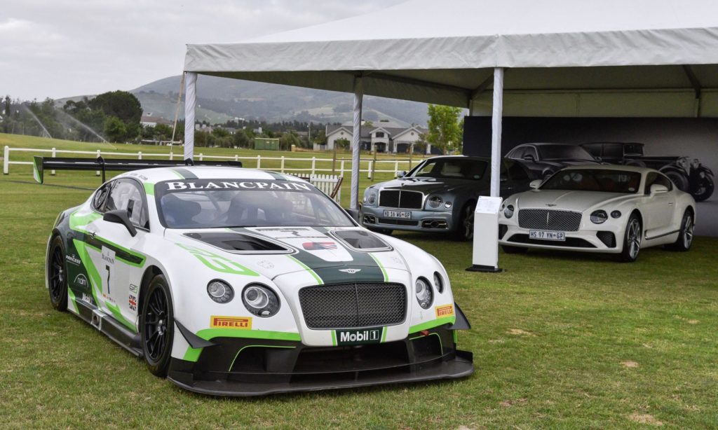 A Bentley Continental GT3 racecar (front) and its roadgoing siblings in the background