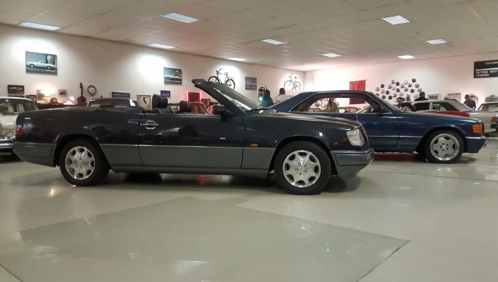 A pristine A124 (W124 cabrio) alongside a mean-looking 560SEC.