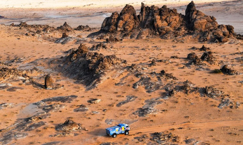 Anton Shibalov, Dmitrii Nikitin and Ivan Tatarinov in the Kamaz navigating between rock formation during stage 4