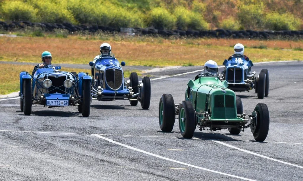 Old racers tearing around the track
