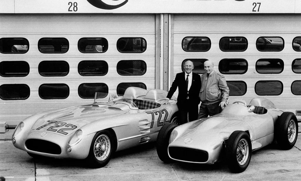 Legendary Mercedes-Benz racing drivers Stirling Moss (left) and Juan Manuel Fangio in 1991 with the 300 SLR (W196S), from the 1955 Mille Miglia, as well as the W196R Formula 1 car.