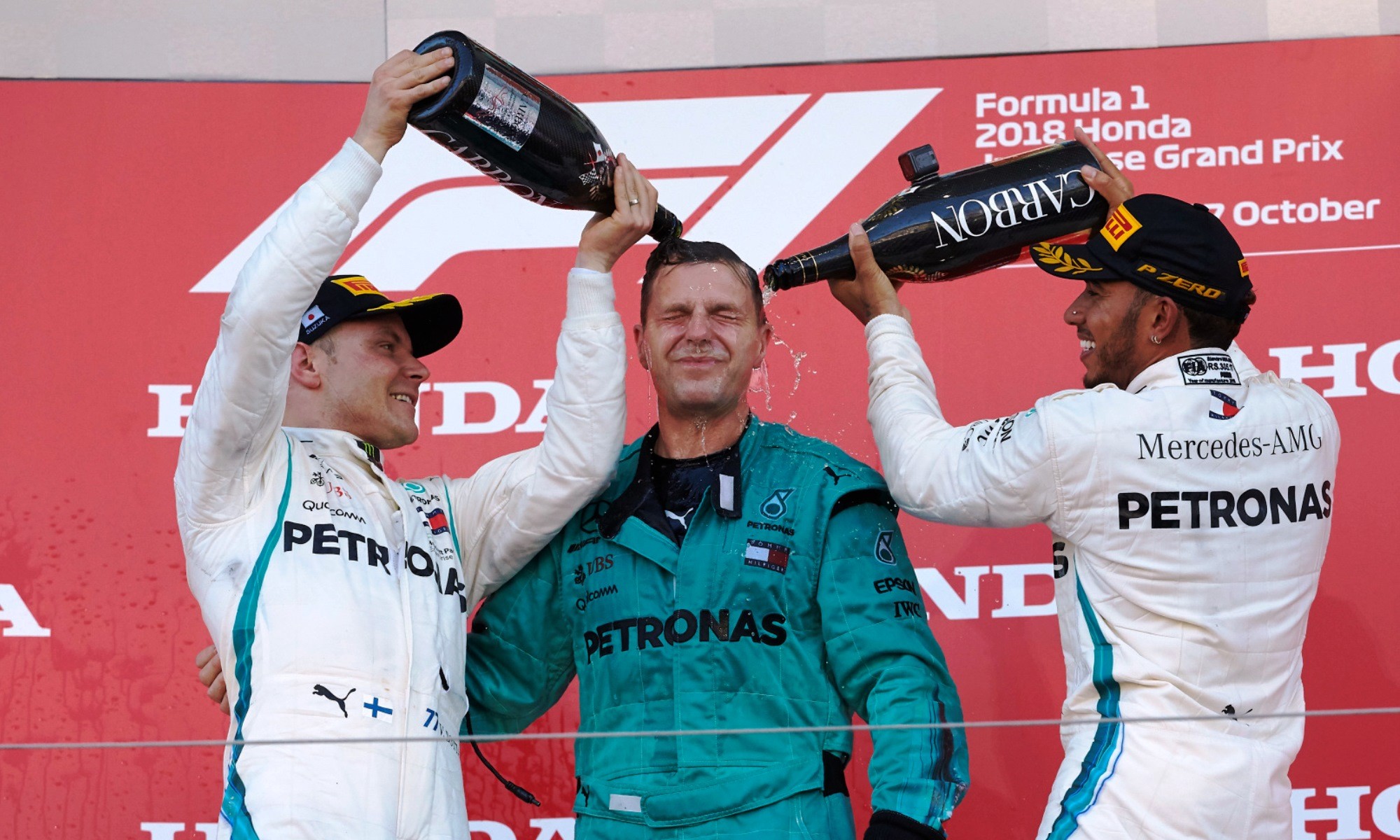 The drivers and engineer enjoy the podium celebrations