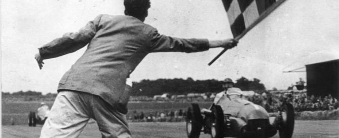 Nino Farina takes the flag in the very first F1 Grand Prix