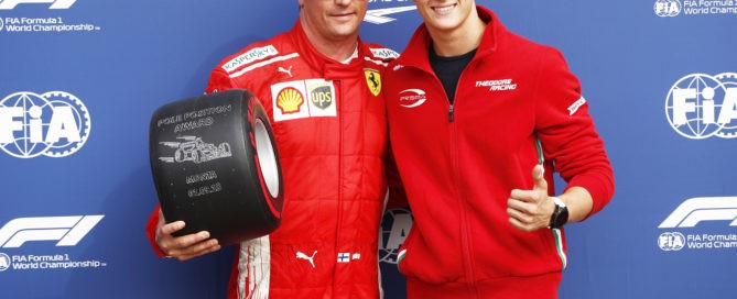 Pole sitter Kimi Raikkonen with Mick Schumacher