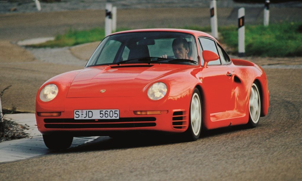 Porsche brand ambassador and test drive Walter Rohrl hustles a 959