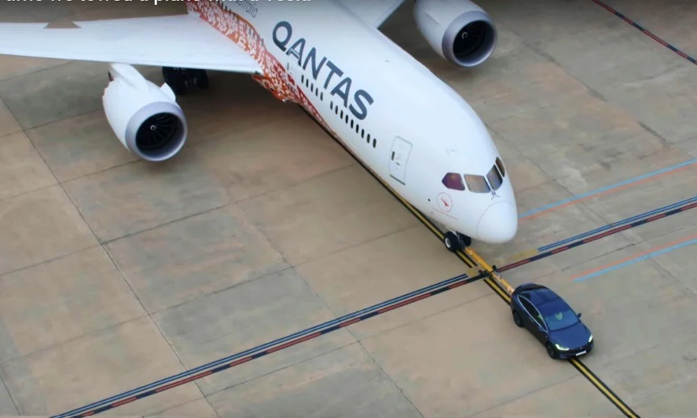 Tesla tows a plane