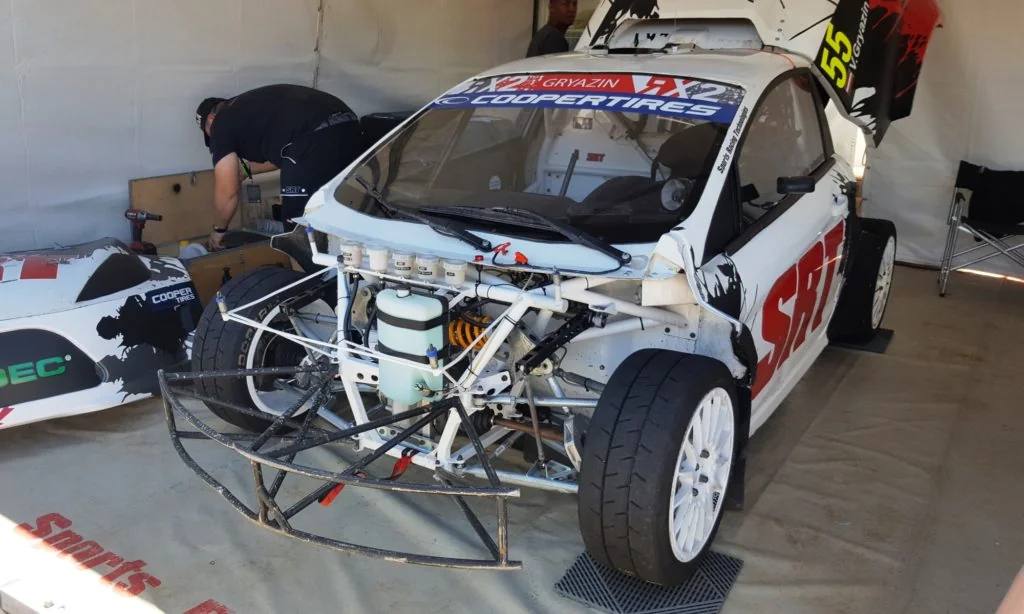 The simple, yet beefy front suspension of an RX2 car.