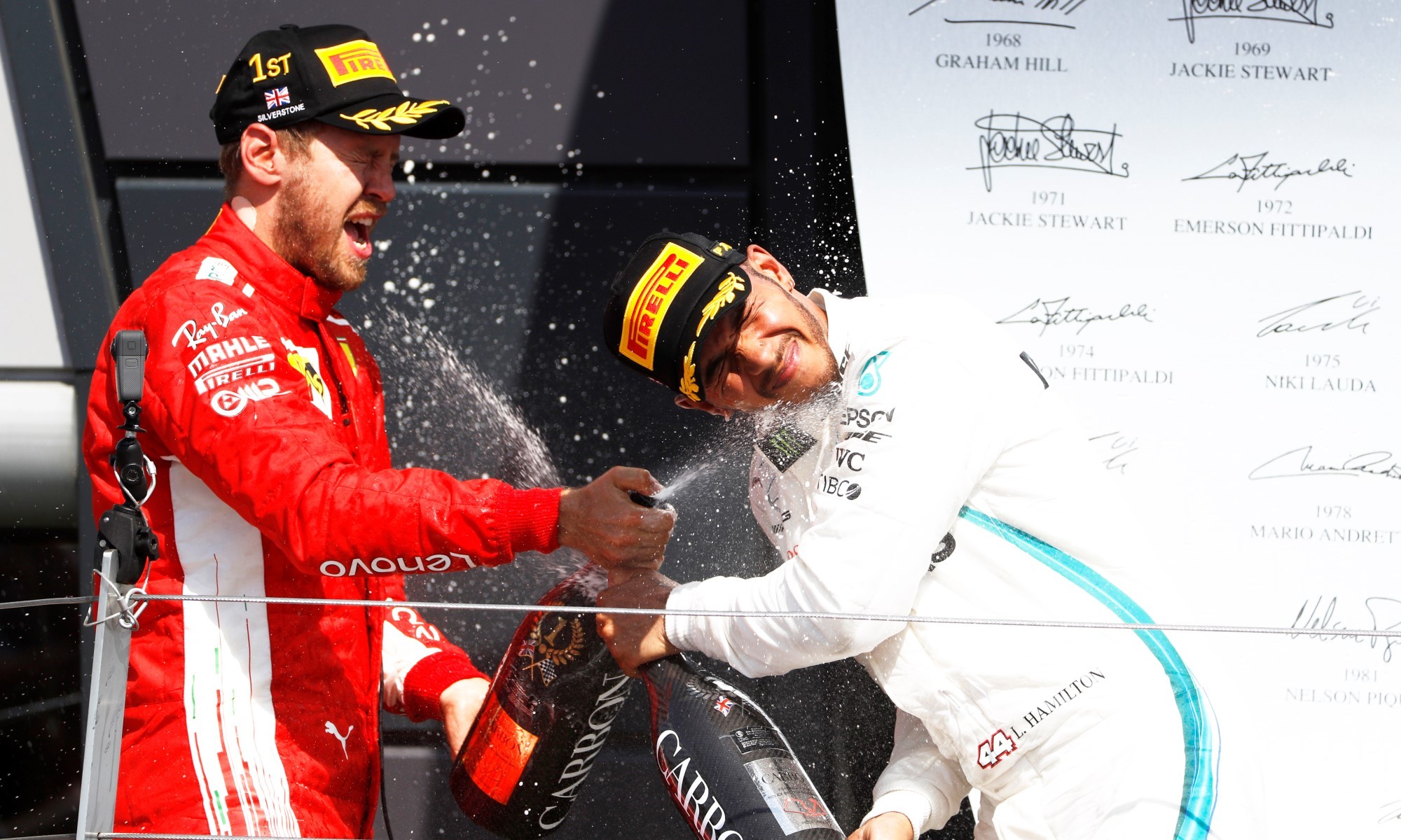 The title rivals douse each other in champagne